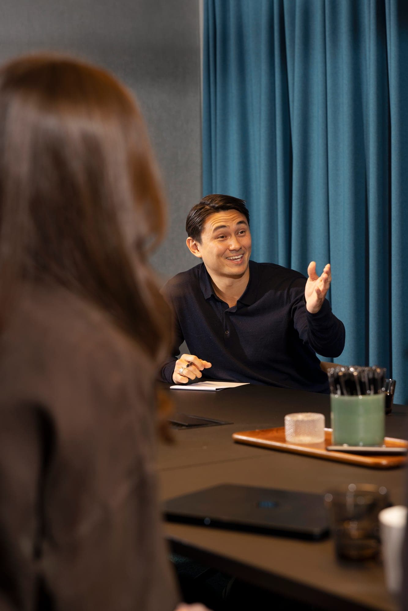An equity specialist explaining something across a desk